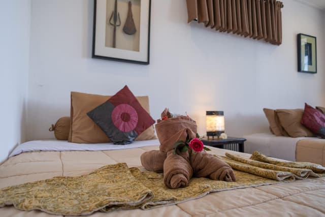 Deluxe Triple Room with Private Balcony and Partial Sea View