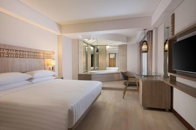 One Bedroom Junior Suite with King Bed and Pool view with Free Shuttle Service to Double-Six Beach
