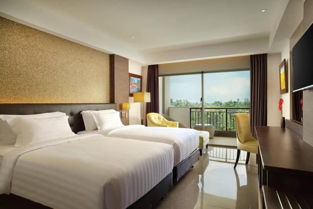 Deluxe Twin Balcony Room with Pool View, with FREE daily shuttle to Ubud City, FREE Photo Session, FREE Art Gallery Visit, 24-hour access to Fitness Center, FREE Welcome Drink, and FREE Kids Activities.